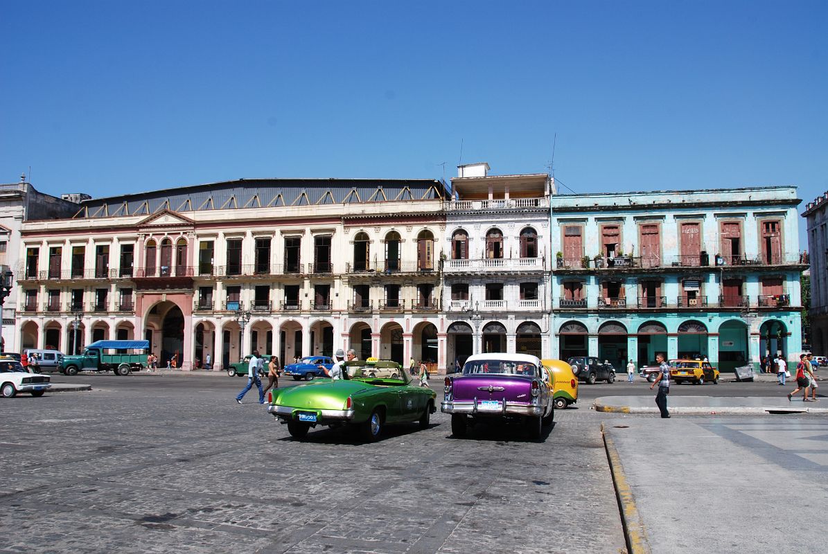 51 Cuba - Havana Centro - Old American Cars and colourful buildings across from Capitolio